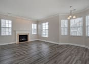 Thumbnail 4 of 26 - an empty living room with a fireplace