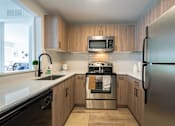 Thumbnail 8 of 34 - Spacious open concept kitchen at The Emerson Apartment