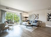 Thumbnail 1 of 34 - Spacious living room at The Emerson Apartments in Ann Arbor, MI