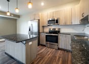 Thumbnail 5 of 27 - Kitchen at Apartments in Grand Rapids | Trowbridge Flats Apartments Grand Rapids MI