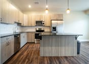 Thumbnail 2 of 27 - Kitchen at Apartments in Grand Rapids | Trowbridge Flats Apartments Grand Rapids MI