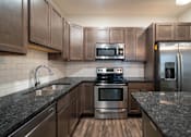 Thumbnail 3 of 27 - Kitchen at Apartments in Grand Rapids | Trowbridge Flats Apartments Grand Rapids MI
