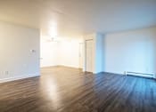 Thumbnail 7 of 18 - Living room at Whispering Pines Apartments in Holland, Michigan