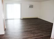 Thumbnail 8 of 18 - Living room at Whispering Pines Apartments in Holland, Michigan