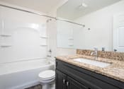 Thumbnail 10 of 18 - Bathroom at Whispering Pines Apartments in Holland, Michigan