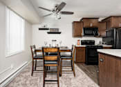 Thumbnail 12 of 18 - Spacious Living Room in East Lansing Apartments near Michigan State University | Woodbrook Village Apartments
