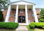 Thumbnail 4 of 5 - Exterior at Woodruff House Apartments in Lansing, MI