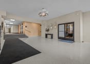 Thumbnail 14 of 16 - the preserve at ballantyne commons lobby with carpeted flooring and glass doors