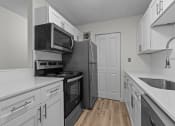 Thumbnail 2 of 73 - the preserve at ballantyne commons apartment kitchen with stainless steel appliances