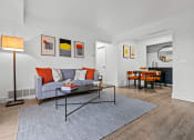 Thumbnail 6 of 21 - a living room with a couch and a table  at Park On Canal Apartments, Clinton Twp, 48038