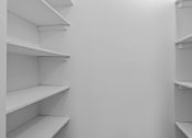 Thumbnail 12 of 73 - white shelves in a white closet in a room