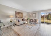 Thumbnail 9 of 41 - Living Room With Balcony at Rochester Club Apartments - Rochester, MI, Rochester Hills, 48306