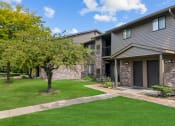 Thumbnail 36 of 44 - our apartments have a spacious yard with green grass and trees