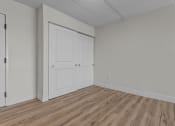Thumbnail 10 of 73 - the living room of an apartment with white walls and wood flooring