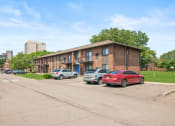Thumbnail 42 of 46 - a brick apartment building with a parking lot in front of it at Lafayette Park Place, Detroit, MI, 48207
