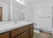 Thumbnail 29 of 35 - a bathroom with a toilet sink and shower