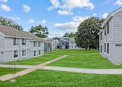 Thumbnail 46 of 50 - a view of a yard in front of a row of houses