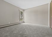 Thumbnail 24 of 35 - a bedroom with grey walls and carpet