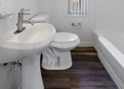 Thumbnail 14 of 32 - a bathroom with a sink toilet and a bath tub