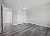 Thumbnail 12 of 26 - A room with a grey floor and white walls.