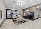 Thumbnail 48 of 58 - A modern living room with a black entertainment center and a large abstract painting on the wall.