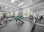 Thumbnail 73 of 87 - Spacious fitness center with exercise equipment at Village Club of Farmington Hills Apartments, Farmington Hills, 48331