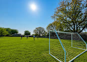 Thumbnail 18 of 30 - A soccer game is being played in a field with a goal on the right. at Park On Canal Apartments - Clinton Twp, MI Apartments, Clinton Twp, MI, 48038