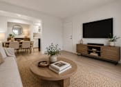 Thumbnail 6 of 30 - A living room with a couch, a coffee table, a dining table, and a television. at Park On Canal Apartments - Clinton Twp, MI Apartments, Michigan