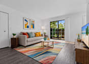 Thumbnail 5 of 26 - A living room with a grey couch, a coffee table, a rug, and a painting on the wall.