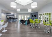 Thumbnail 34 of 43 - A modern open plan living and kitchen area with a bar.