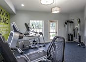 Thumbnail 35 of 43 - A gym with a green wall that says "work hard and be proud of what you achieve".