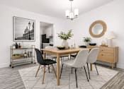 Thumbnail 5 of 29 - A dining room with a wooden table and chairs.