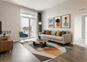 Thumbnail 23 of 58 - A living room with a sofa, a chair, a coffee table, and a rug.