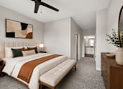Thumbnail 13 of 39 - A bedroom with a large bed and a painting on the wall.