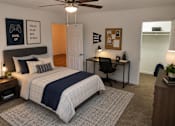 Thumbnail 10 of 20 - A bedroom with a bed, desk, and ceiling fan.