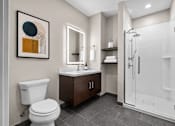 Thumbnail 22 of 58 - A bathroom with a toilet, sink, and shower.