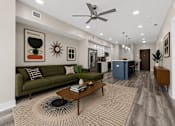 Thumbnail 26 of 58 - A living room with a green couch and a coffee table.