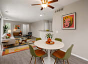 Thumbnail 55 of 87 - Open concept dining and living area with modern furnishings at Village Club of Farmington Hills Apartments, Farmington Hills, 48331