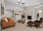 Thumbnail 45 of 87 - Open concept living room with modern furniture and fireplace at Village Club of Farmington Hills Apartments, Farmington Hills