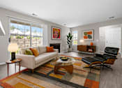 Thumbnail 62 of 87 - Carpeted living room with large window at Village Club of Farmington Hills Apartments, Farmington Hills, MI