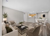 Thumbnail 33 of 87 - Open living and dining space with wood style flooring at Village Club of Farmington Hills Apartments, Michigan