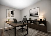 Thumbnail 36 of 87 - Home office with modern desk and bookshelf at Village Club of Farmington Hills Apartments, Michigan, 48331