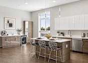 Thumbnail 1 of 64 - A modern kitchen with a dining table and chairs.