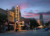 Thumbnail 35 of 39 - A street view of a city with a large building that has the word "Michigan" on it.