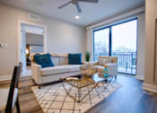 Thumbnail 11 of 31 - a spacious living room with city views