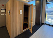 Thumbnail 24 of 31 - A wooden room divider with a door open to a hallway.