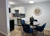 Thumbnail 1 of 44 - A kitchen with a dining table and chairs. at The Park on 13 Apartments - Royal Oak, MI Apartments, Royal Oak, Michigan
