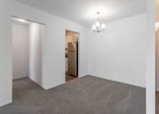 Thumbnail 18 of 25 - an empty room with a refrigerator in it