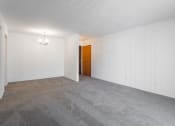 Thumbnail 23 of 25 - an empty room with white walls and a door