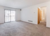 Thumbnail 24 of 25 - an empty living room with a sliding glass door